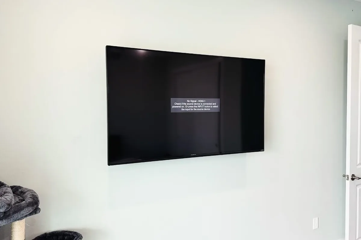 Flush wall-mounted flat-screen TV with clean cable-free installation