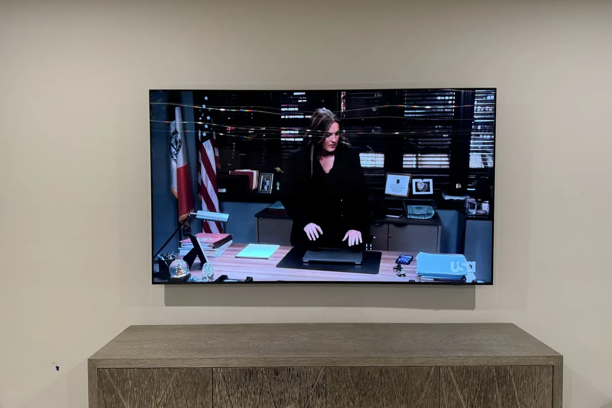 Television screen displaying news broadcast in Naples client home