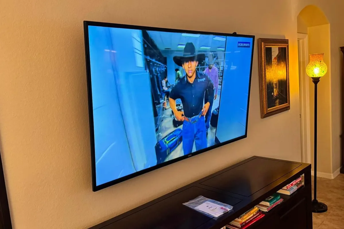 Wireless TV mount with no cables shown above a TV stand in Naples
